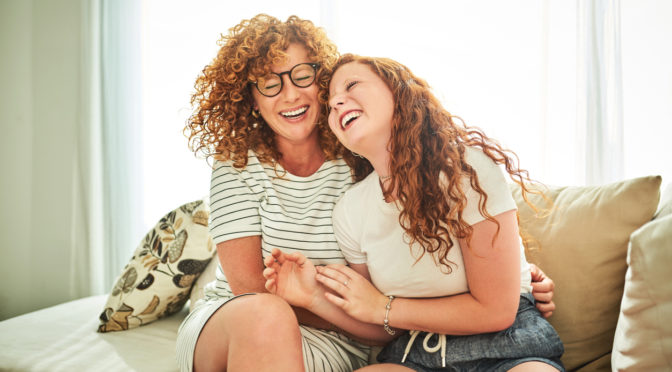 Happy mother & daughter laughing