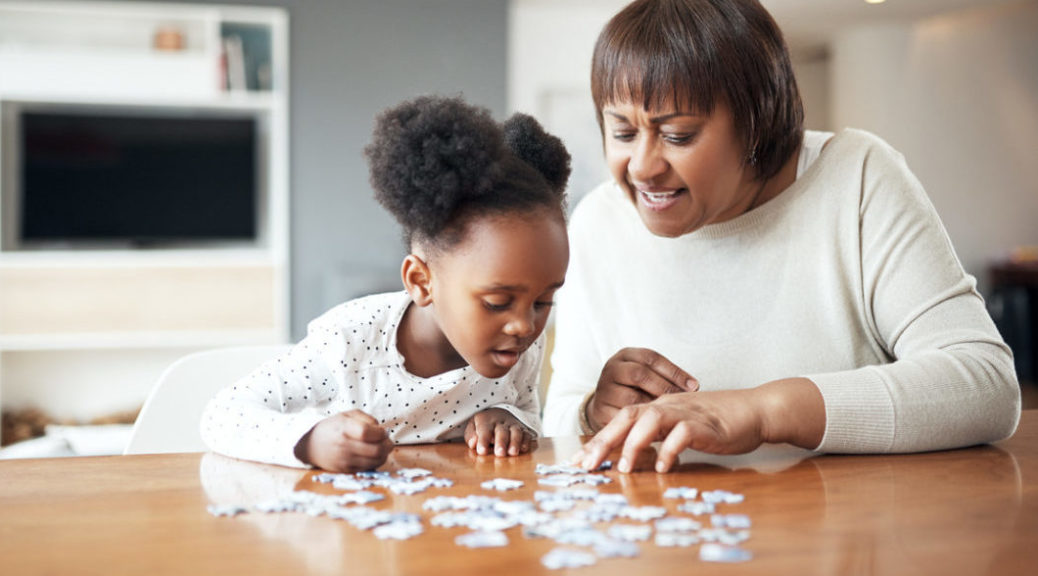 Family doing puzzle to calm coronavirus anxiety