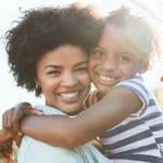 Mom and daughter hug - We all need connection - KVC Health Systems' new tagline