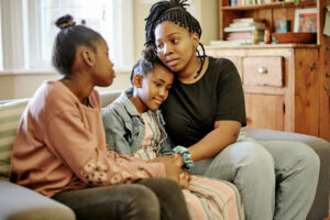 parent comforting children