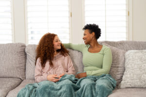 parent and child on couch together