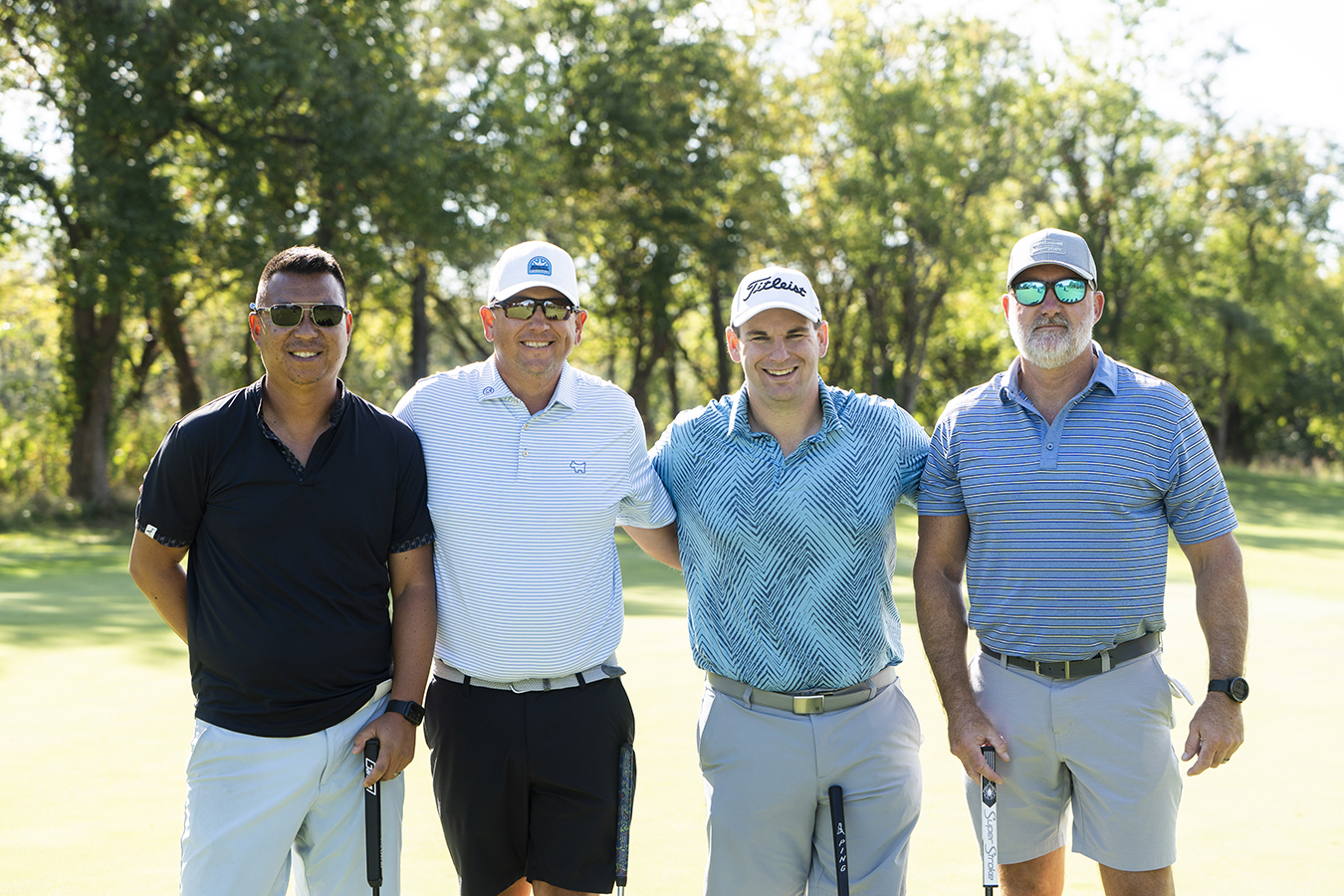 McCartney Stucky LLC golf team poses on the course after earning first place at the 25th Annual KVC Kids Classic.